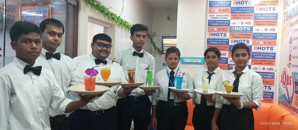 Students posing with colorful tropical mocktails.
